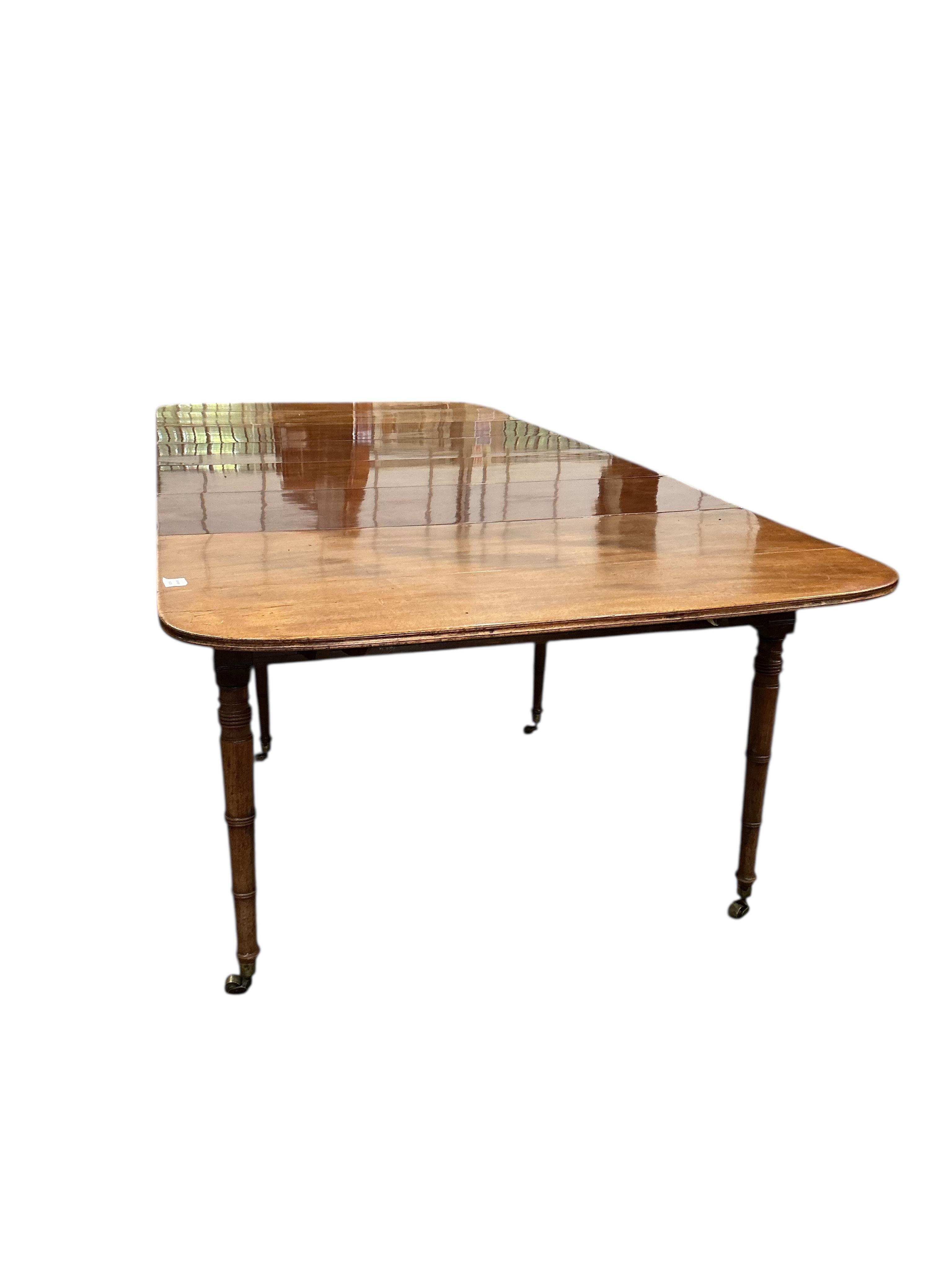 A Regency mahogany Pembroke extending dining table, width 258cm extended, depth 114cm, height 73cm
